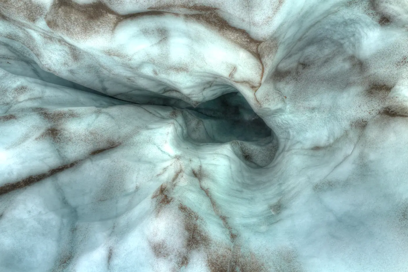 An ice cave, curved blue light