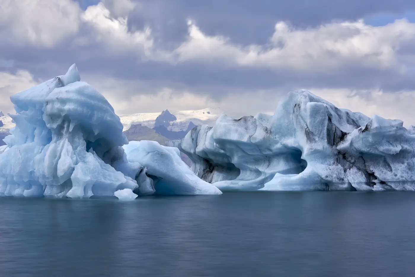 Icebergs on calm water