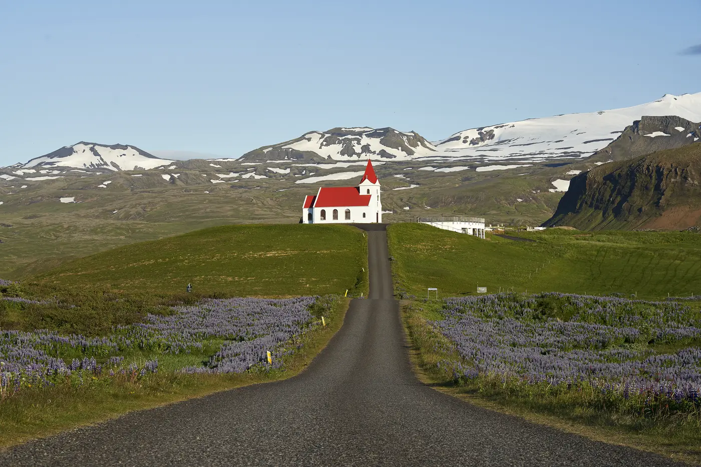 A road winding through green hills