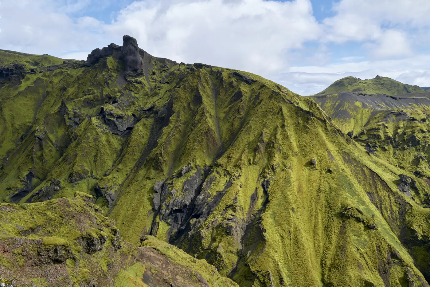 A moss-green highland panorama