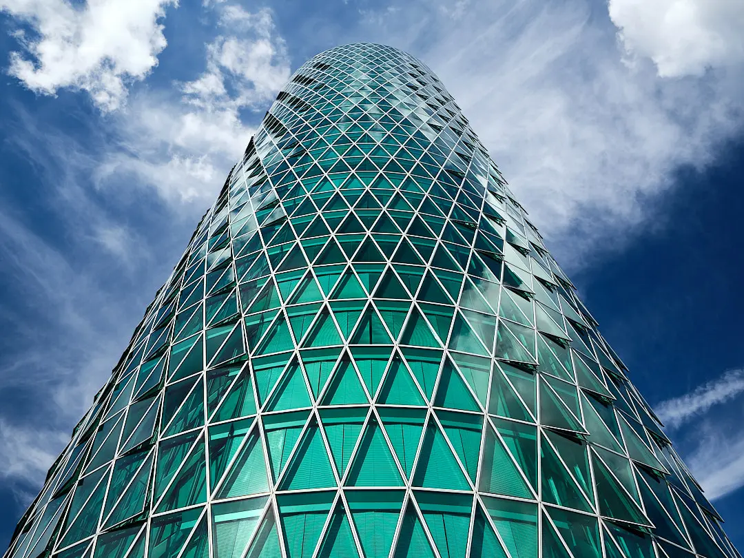 A glass tower with a spiralling façade